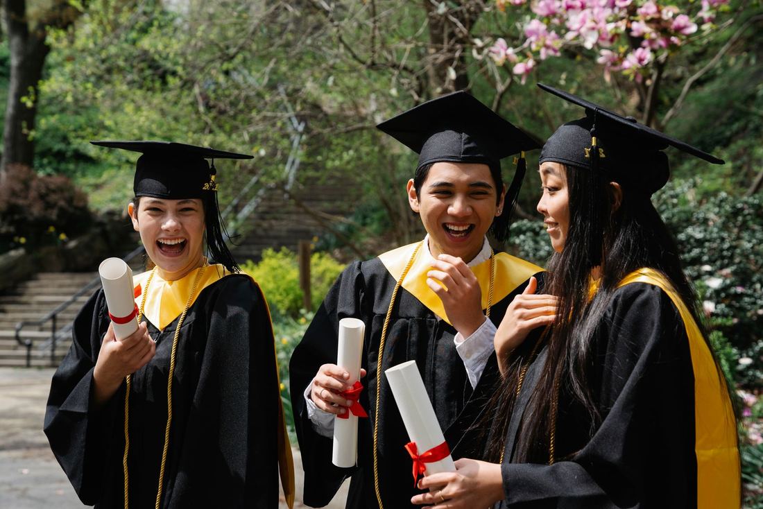 WIC graduates celebrating with their diplomas